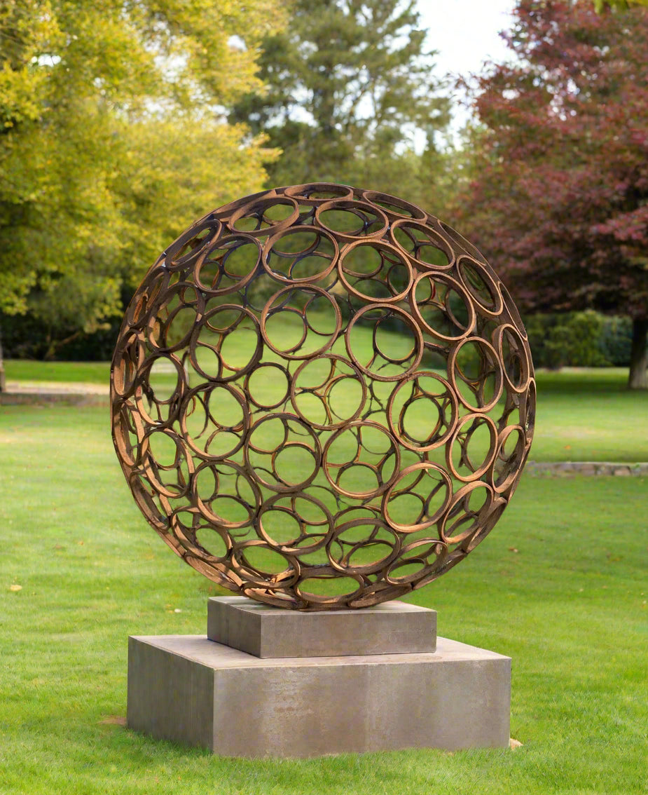 Garden Sphere Sculpture - Large Rustic Outdoor steel artwork on concrete base, featuring weathered metal rings, ideal for lawn or patio decor.