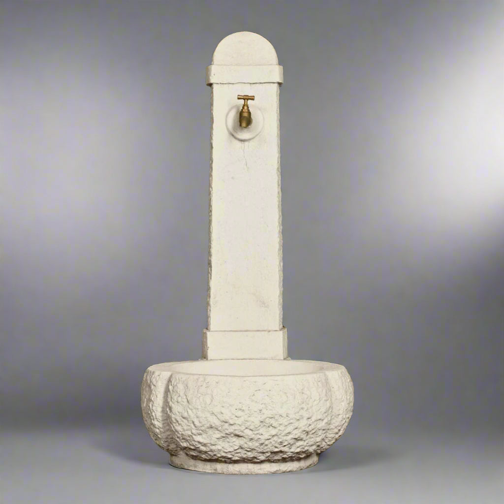 Stone Fountain - Large Stone Fountain with Rounded Base featuring a tall textured column and brass spout, ideal for garden or patio decor.