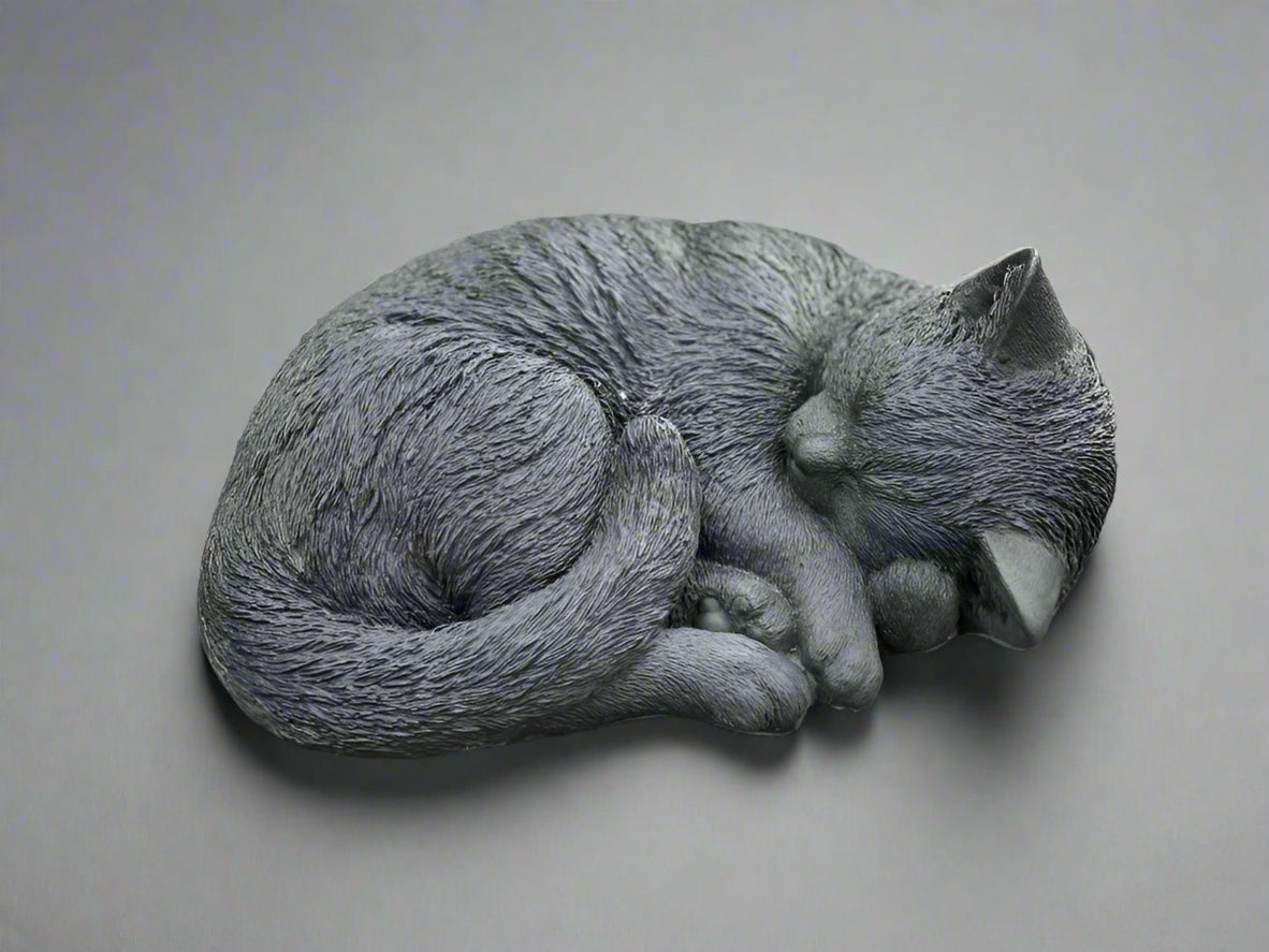 Stone sleeping cat statue with detailed fur texture, ideal for garden decor or pet memorials. Measures 10cm x 20cm x 30cm.