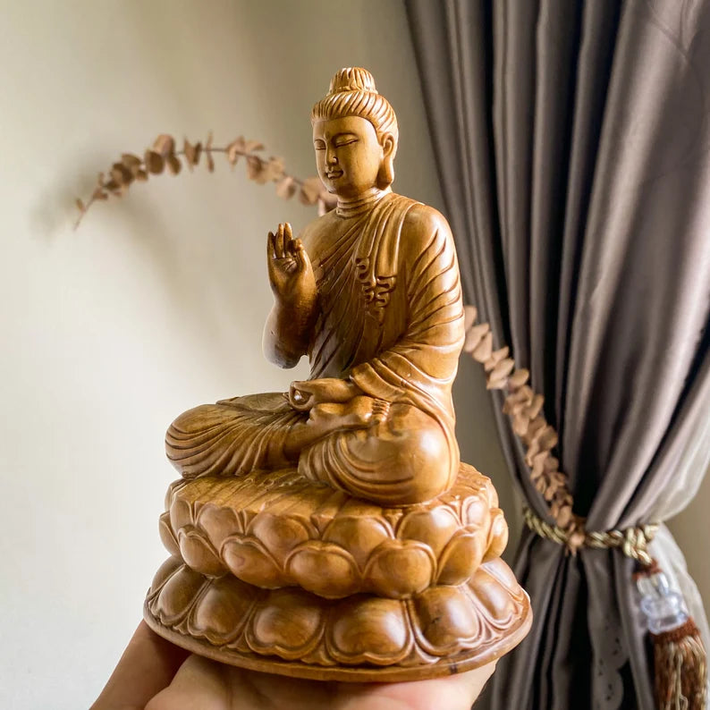 Angled view of Wooden Abhaya Buddha Statue in Abhaya mudra, representing peace and protection, ideal for zen or yoga decor themes.