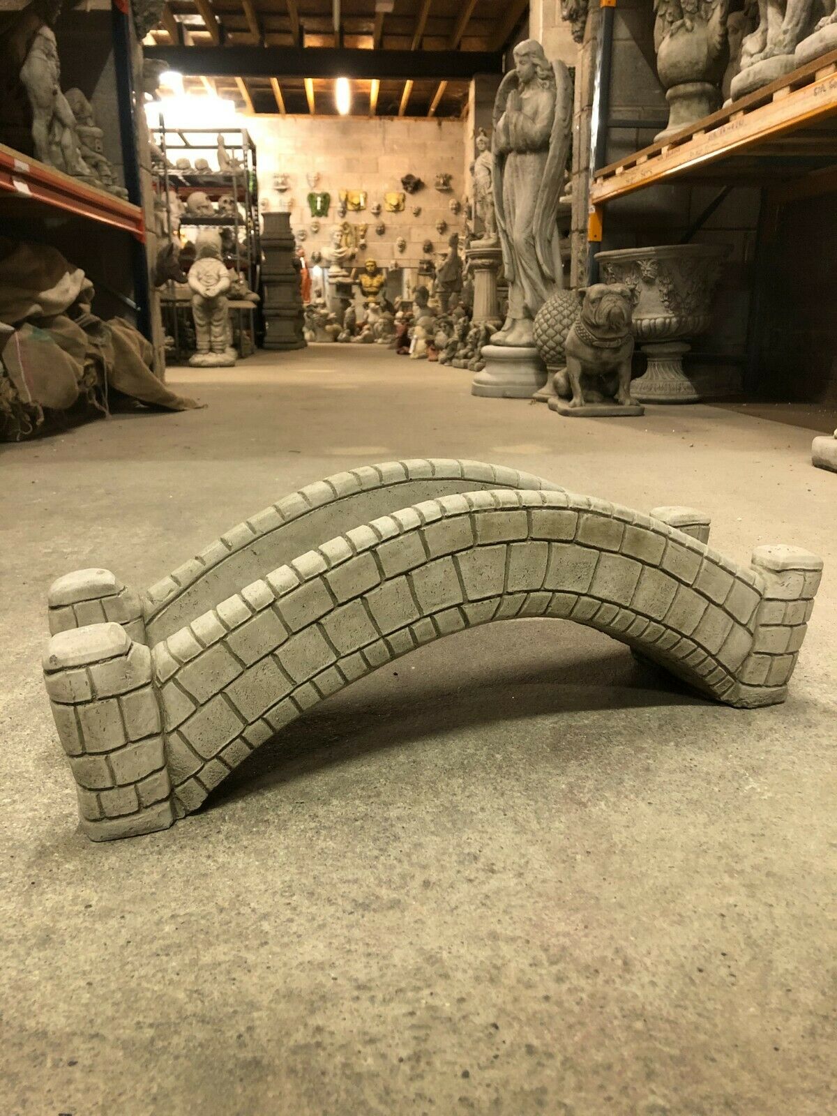 Garden ornament - stone pond bridge with antique finish, arched design and brick detail, ideal for outdoor decor or small water features.