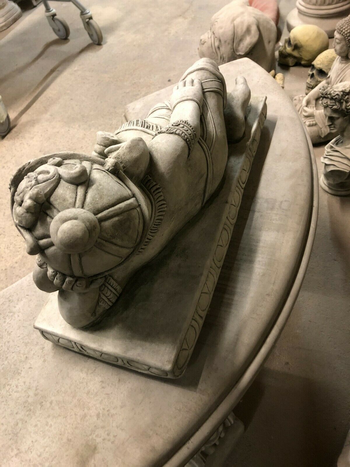 Rear view of Stone Laying Down Ganesh Statue showing ornate headpiece and craftsmanship, suitable for garden or patio display.