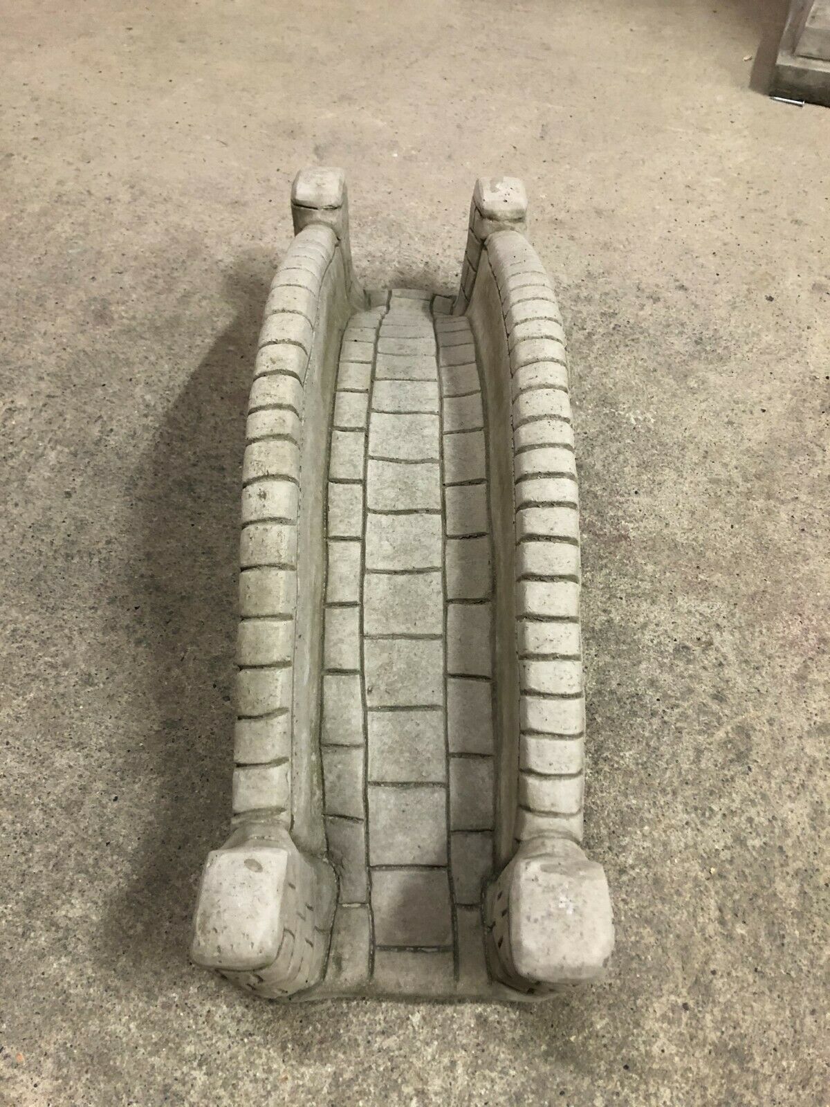 Top view of stone pond bridge garden ornament with antique finish, highlighting detailed paving and durable concrete design for outdoor use.