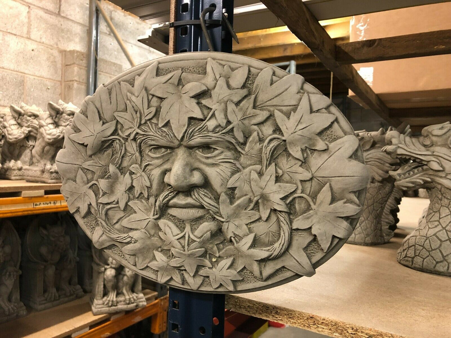 Antique Stone Oval Greenman Plaque with intricate leaf patterns and lifelike facial features, perfect for unique garden or patio wall decoration.