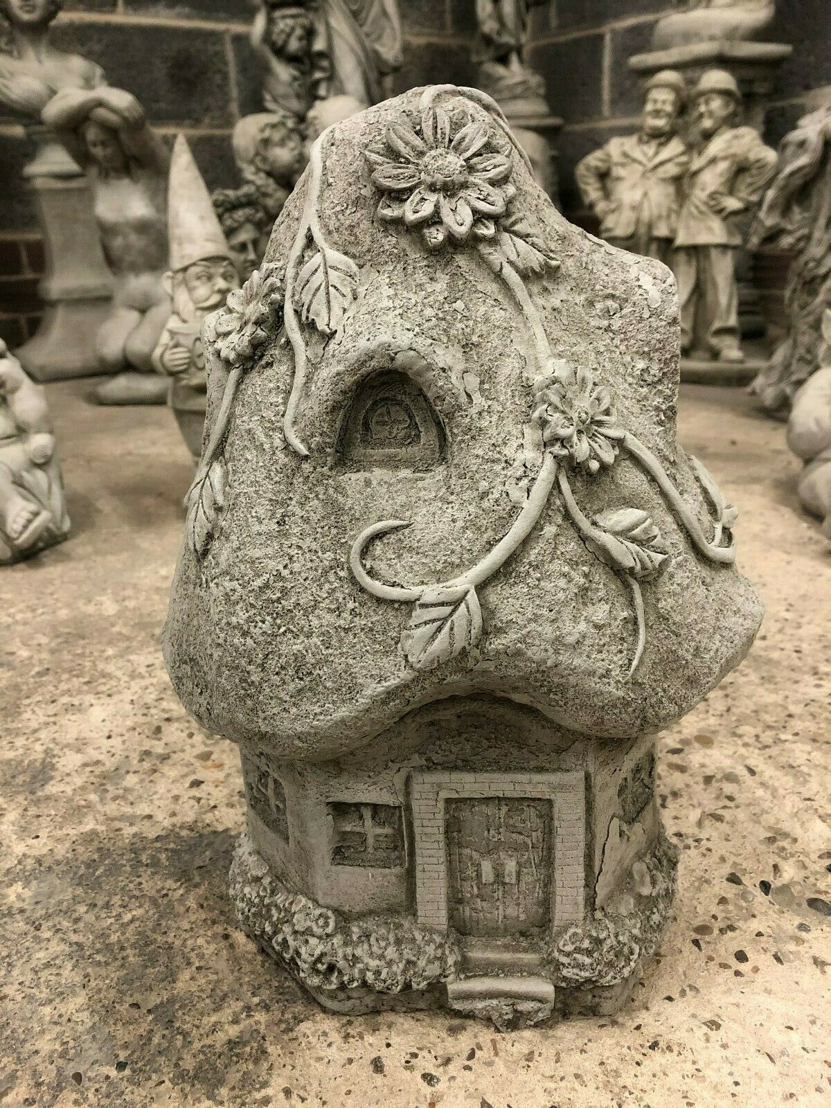Stone Cottage Ornament for Magical Garden Decor featuring detailed floral vines and arched windows, crafted from durable limestone for outdoor use.