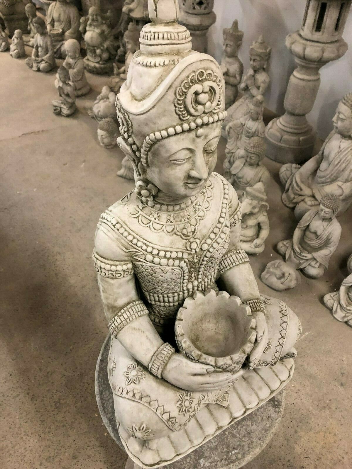 Top angle of Stone Buddha Bust - Garden Ornament highlighting the detailed crown and lotus bowl, ideal for peaceful garden ambiance.