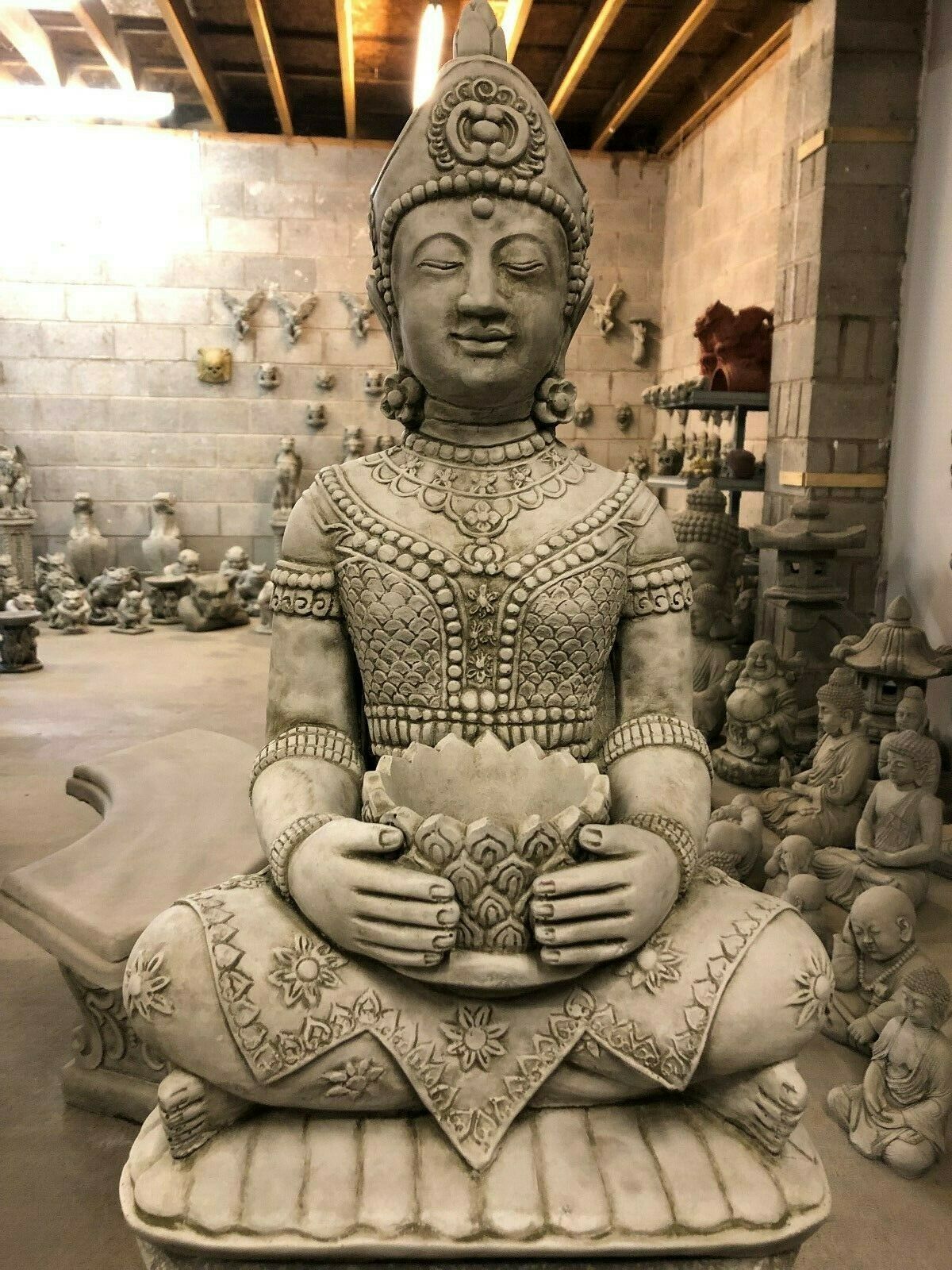 Front close-up of Stone Buddha Bust - Garden Ornament showing peaceful face and detailed attire, perfect for tranquil garden settings.