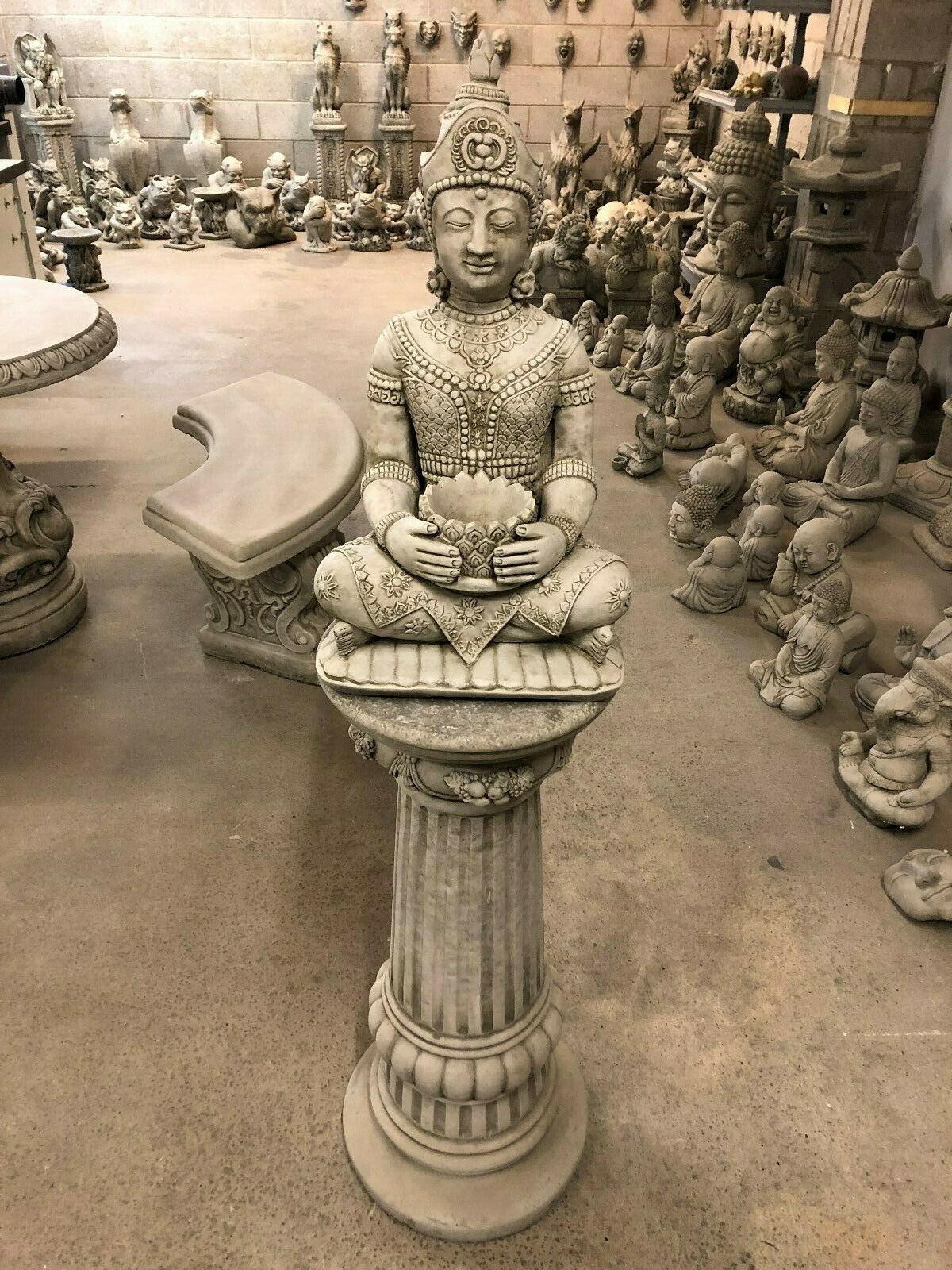 Full frontal view of Stone Buddha Bust - Garden Ornament on a tall plinth, ideal for creating a serene focal point in any garden.