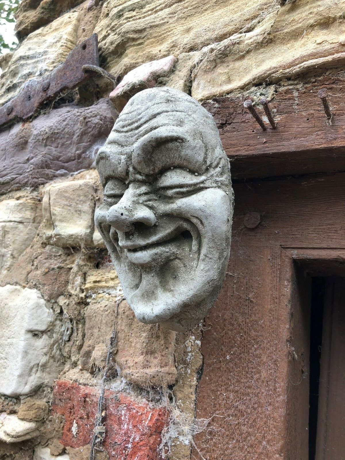 Stone Smug Face Wall Plaque