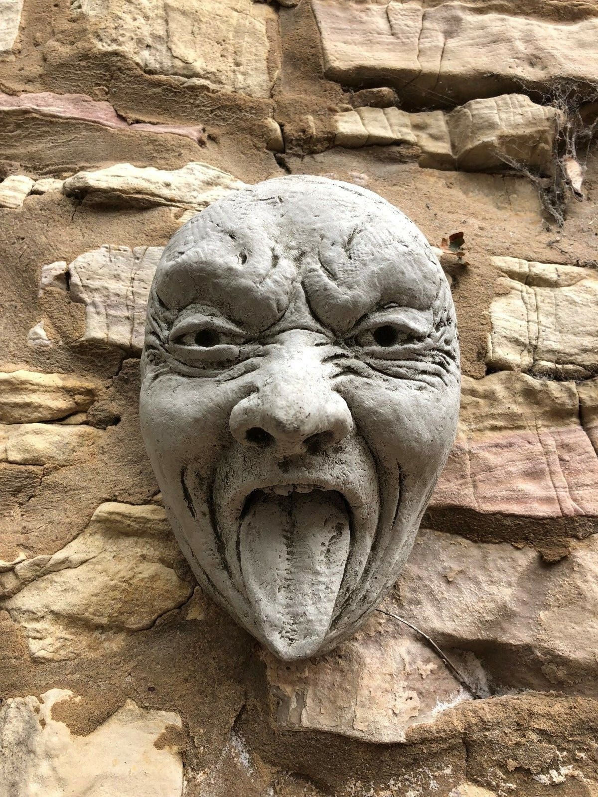 Stone Funny Tongue Out Face Wall Plaque