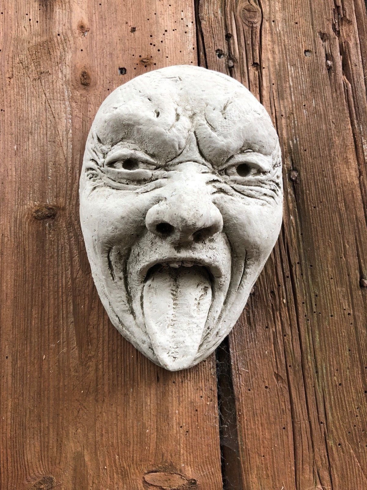 Stone Funny Tongue Out Face Wall Plaque
