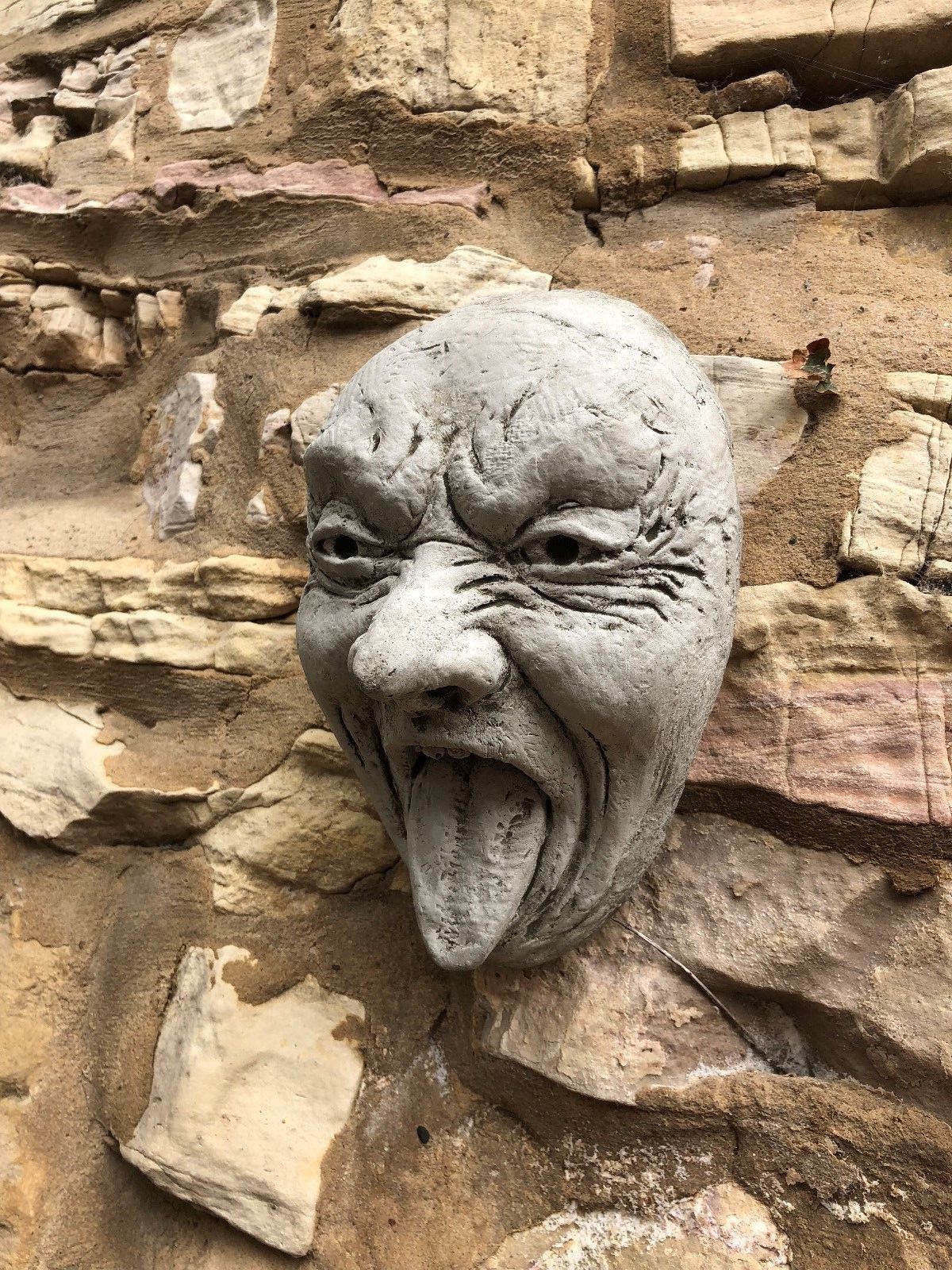 Stone Funny Tongue Out Face Wall Plaque