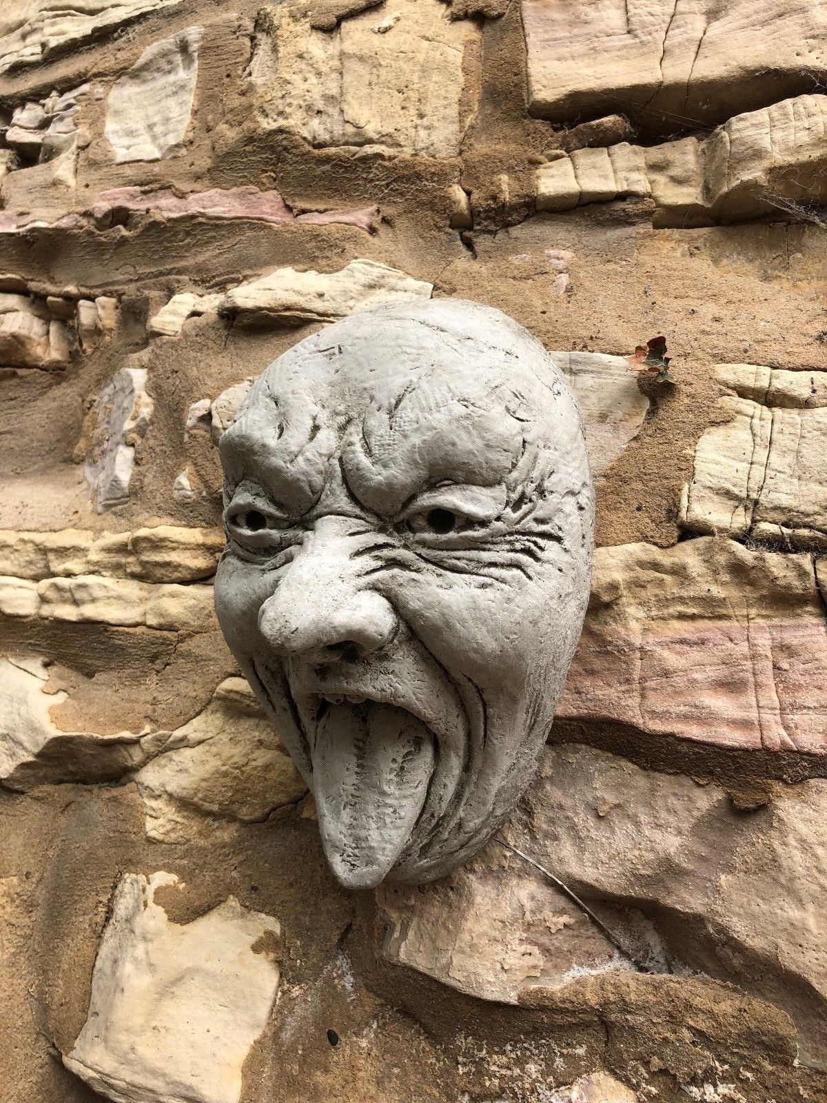 Stone Funny Tongue Out Face Wall Plaque