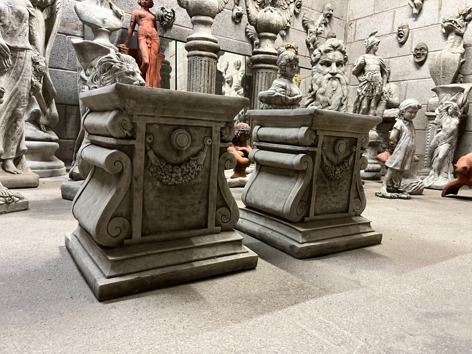 Pair of Stone Garland Style Plinths