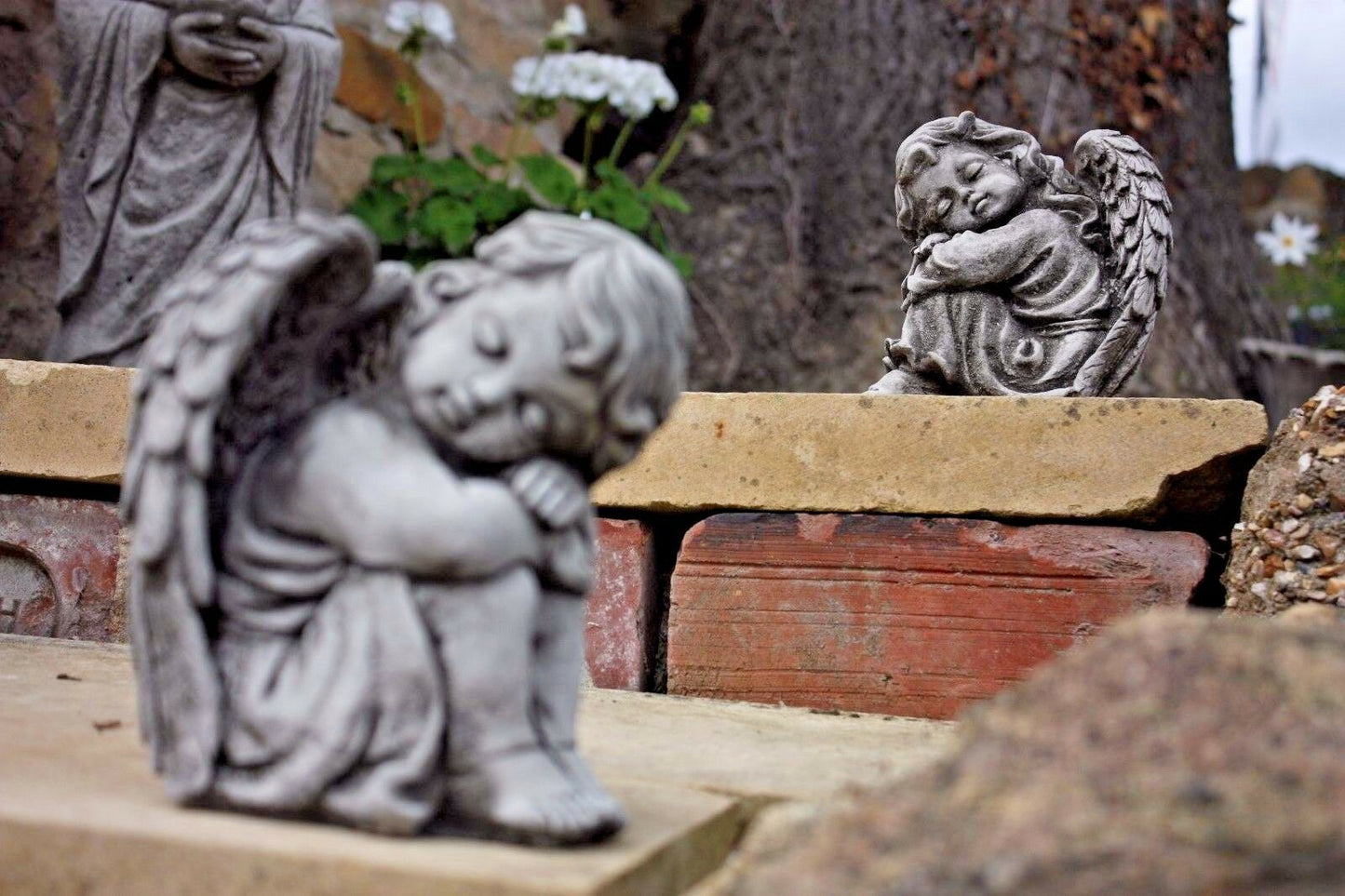 Pair of Small Stone Sleeping Angel Ornaments